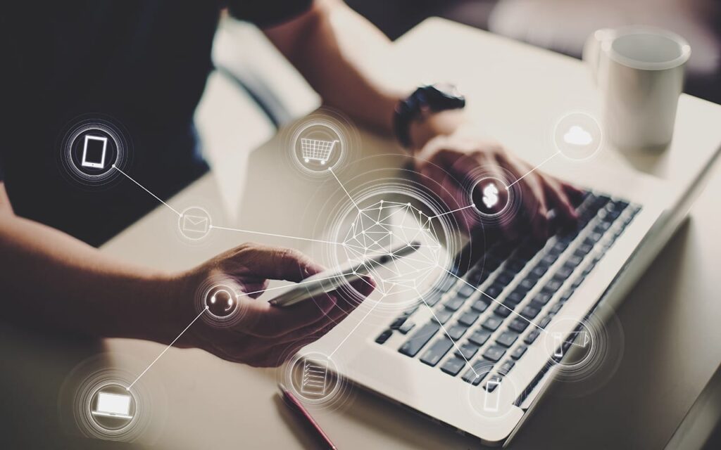 Marketer managing PPC Dubai campaigns across mobile, laptop, ecommerce, and payment channels